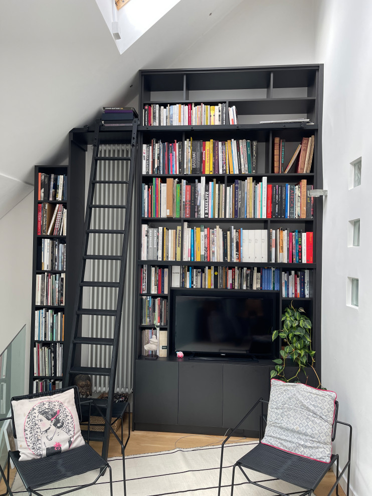 Black spray painted library bookshelf with ladder