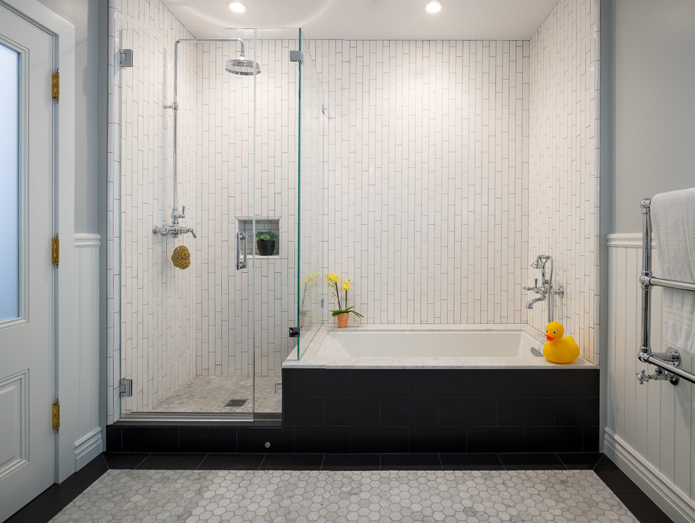 Photo of a traditional kids bathroom in San Francisco with an undermount tub, a corner shower, white tile, grey walls and a hinged shower door.