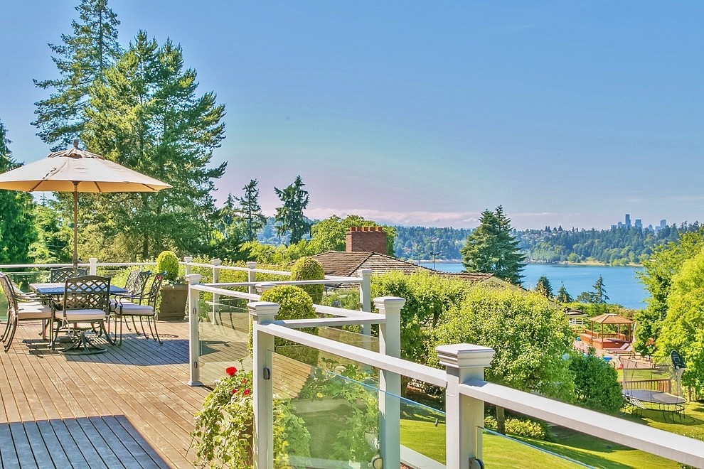Photo of a large transitional backyard deck in Seattle with a container garden and no cover.