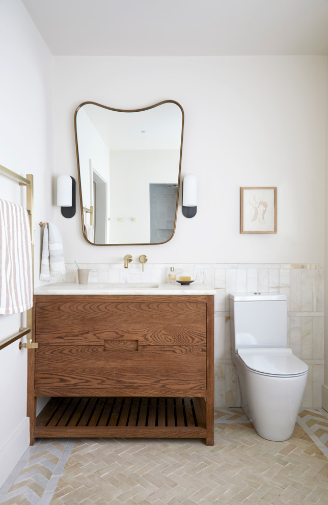 Inspiration for a small scandinavian master bathroom in Wiltshire with flat-panel cabinets, medium wood cabinets, marble, beige walls, terra-cotta floors, marble benchtops, pink floor, a single vanity and a freestanding vanity.