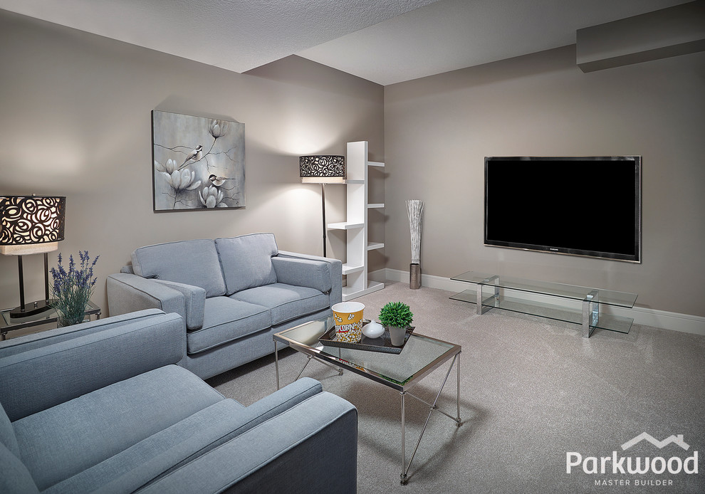Design ideas for a large eclectic enclosed home theatre in Edmonton with grey walls, carpet and a wall-mounted tv.