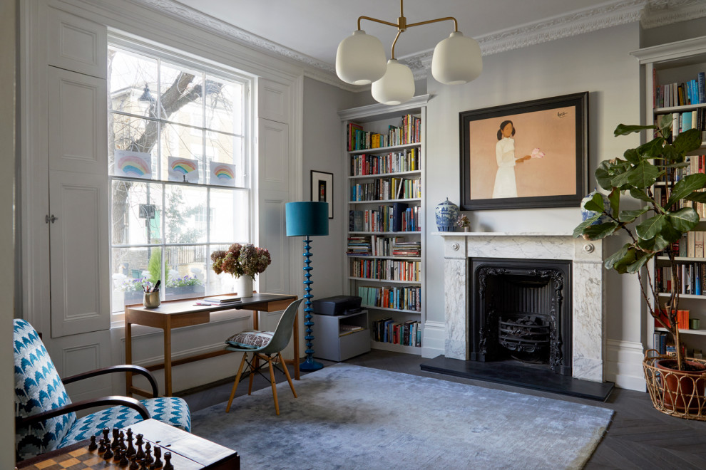 Inspiration for a medium sized victorian home office in London with grey walls, light hardwood flooring, a freestanding desk, grey floors and feature lighting.