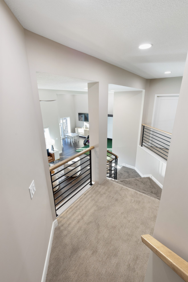 Inspiration for an expansive modern walk-out basement in Kansas City with beige walls.