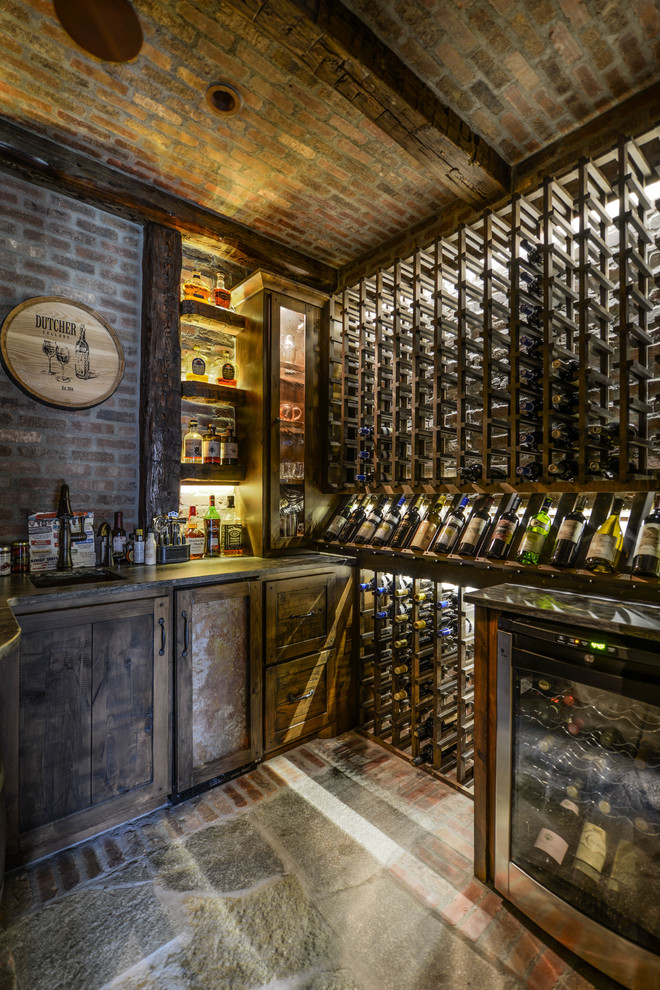 Photo of a mid-sized country wine cellar in Minneapolis with brick floors and storage racks.
