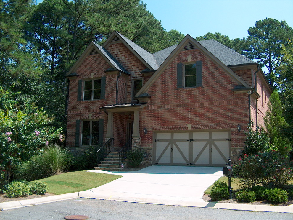 Large arts and crafts two-storey brick red exterior in Atlanta.