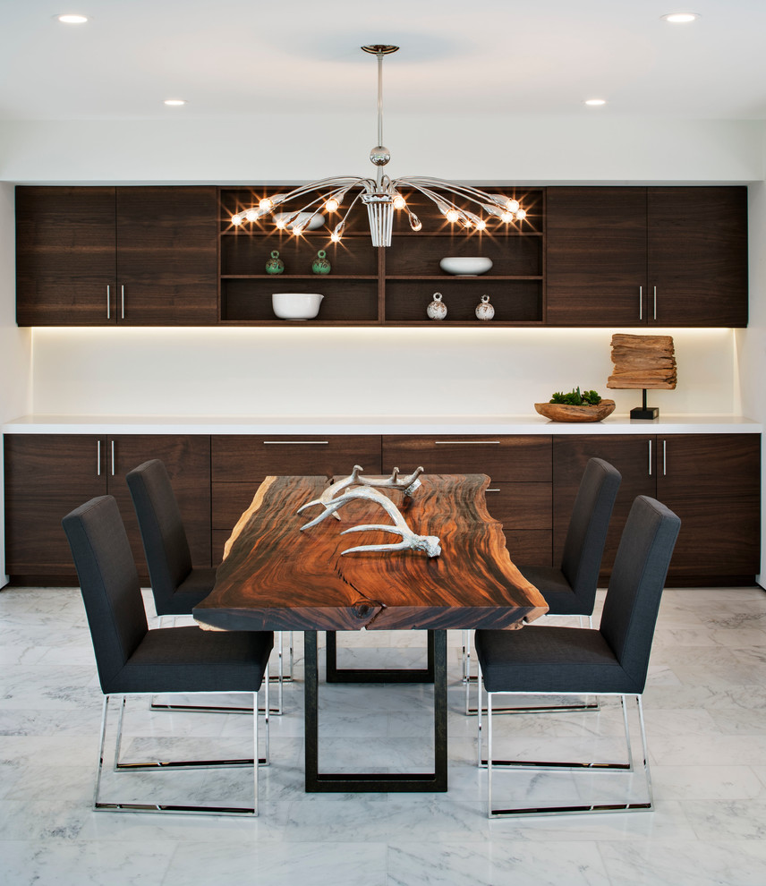 This is an example of a large modern open plan dining in San Diego with white walls and marble floors.