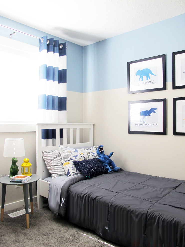 Transitional kids' room in Calgary with blue walls, carpet and grey floor for boys.