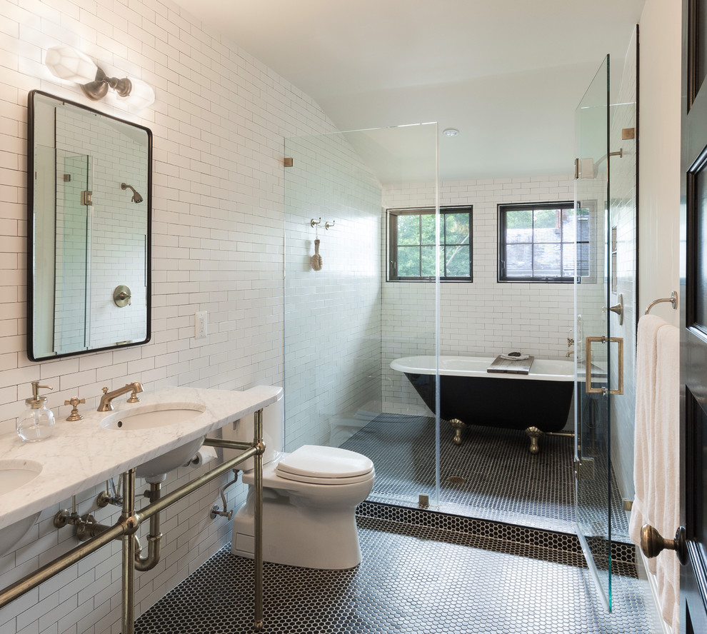 Inspiration for a transitional master wet room bathroom in DC Metro with a claw-foot tub, a two-piece toilet, white tile, subway tile, white walls, mosaic tile floors, a pedestal sink, marble benchtops, black floor, a hinged shower door and white benchtops.