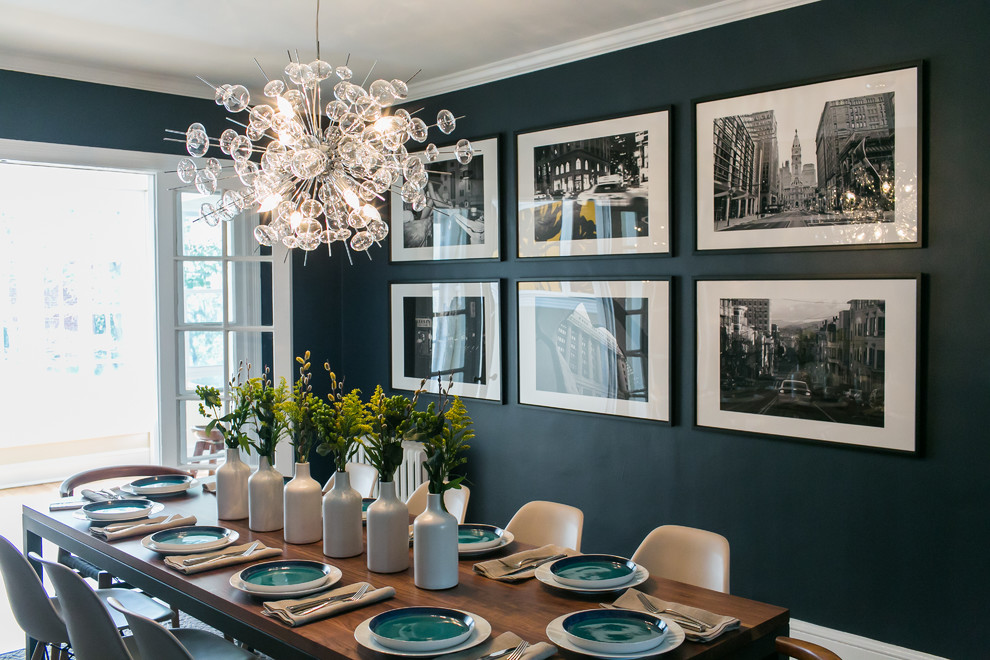 Photo of a mid-sized eclectic separate dining room in DC Metro with blue walls and medium hardwood floors.