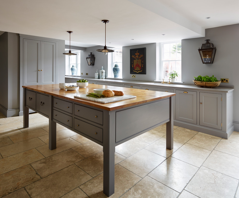 Photo of a large transitional open plan kitchen in Essex with recessed-panel cabinets, grey cabinets, panelled appliances and with island.