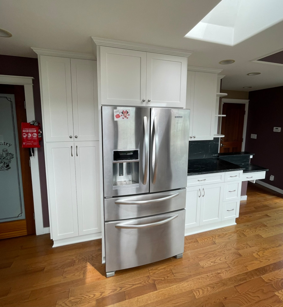Custom White Kitchen Remodel With Black Quartz Counters