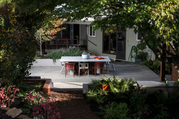 Inspiration for a small modern backyard patio in Portland with an outdoor kitchen, concrete pavers and a gazebo/cabana.