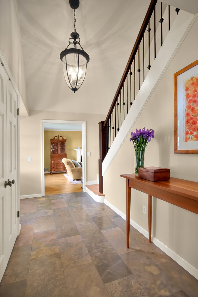 Inspiration for a traditional foyer in Seattle with beige walls and slate floors.