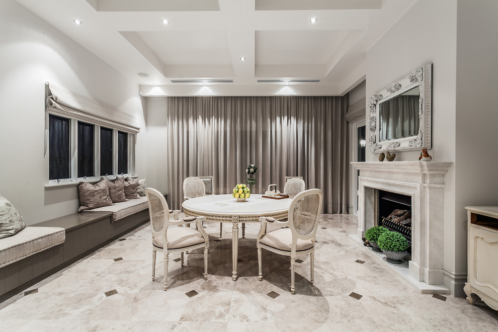 Mid-sized transitional dining room in Perth with a standard fireplace and grey walls.