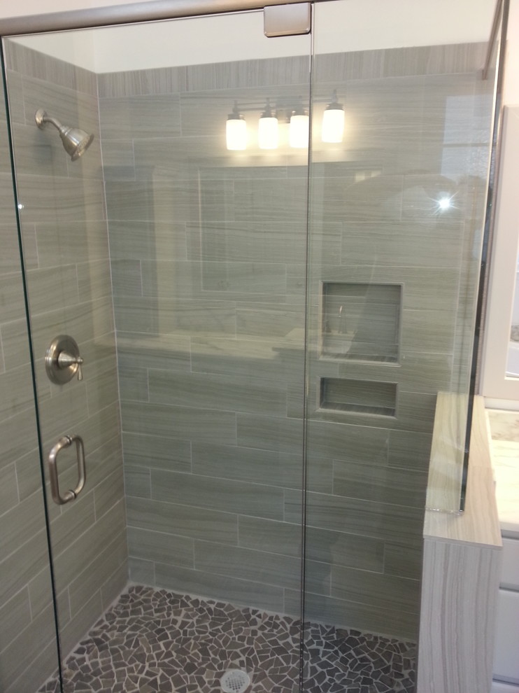 Design ideas for a large contemporary master bathroom in Atlanta with a drop-in sink, raised-panel cabinets, green cabinets, a drop-in tub, a corner shower, a two-piece toilet, gray tile and white walls.