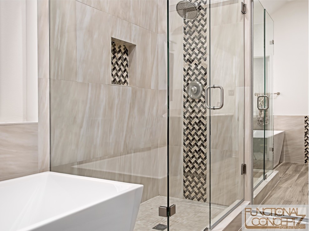 Inspiration for a mid-sized contemporary master bathroom in Dallas with shaker cabinets, dark wood cabinets, a freestanding tub, beige tile, porcelain tile, porcelain floors, marble benchtops and a hinged shower door.