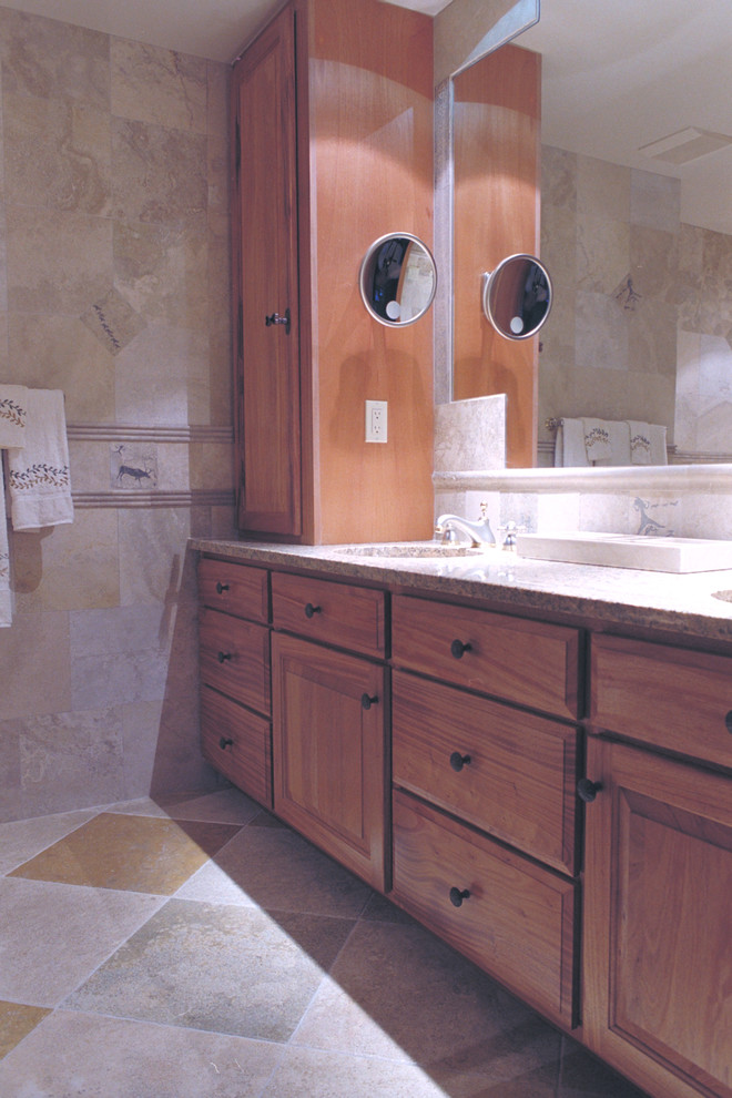 Inspiration for a mid-sized transitional master beige tile and stone tile ceramic tile home design remodel in New York with an undermount sink, raised-panel cabinets, medium tone wood cabinets and quartz countertops