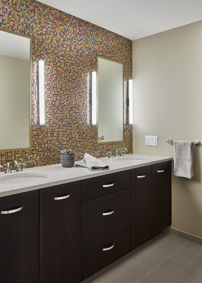 Inspiration for a mid-sized kids' multicolored tile and glass tile ceramic tile, gray floor and double-sink alcove bathtub remodel in Boston with flat-panel cabinets, brown cabinets, a one-piece toilet, beige walls, an undermount sink, quartz countertops, white countertops and a built-in vanity