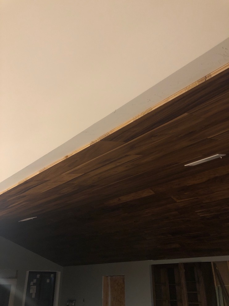 Transitioning between vaulted wood ceiling and regular drywall ceiling