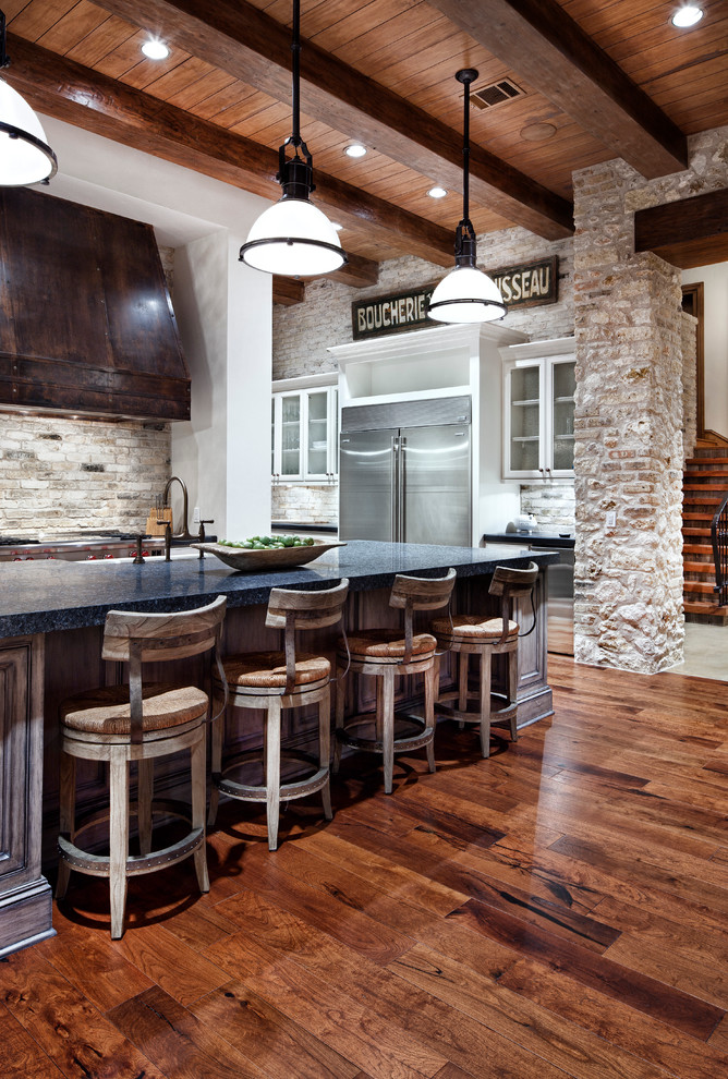 Inspiration for a traditional kitchen in Houston with stainless steel appliances and blue benchtop.