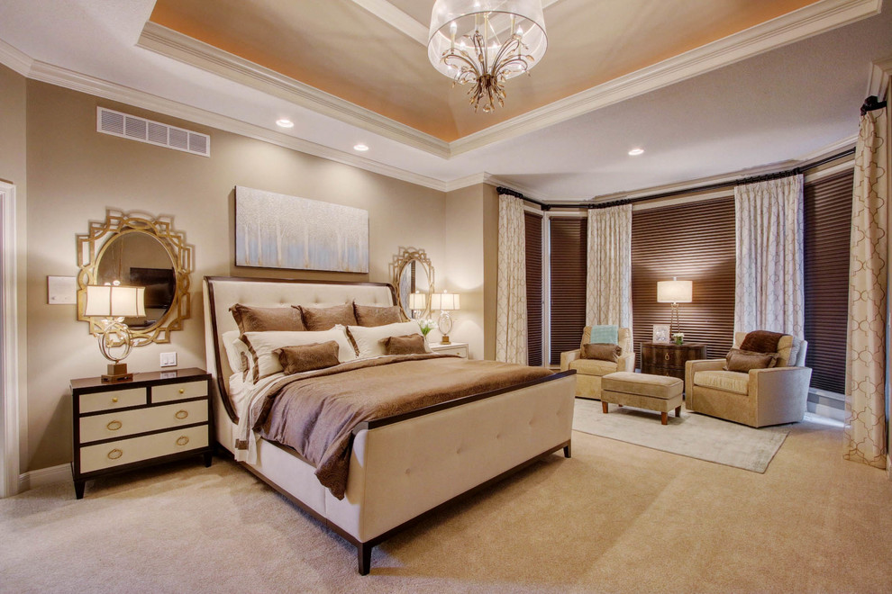 Photo of a large transitional master bedroom in Kansas City with beige walls, carpet and no fireplace.