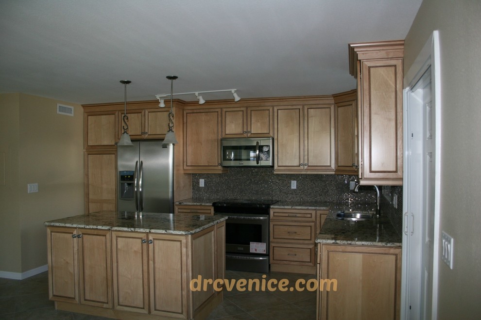 Inspiration for a timeless kitchen remodel in Tampa with raised-panel cabinets