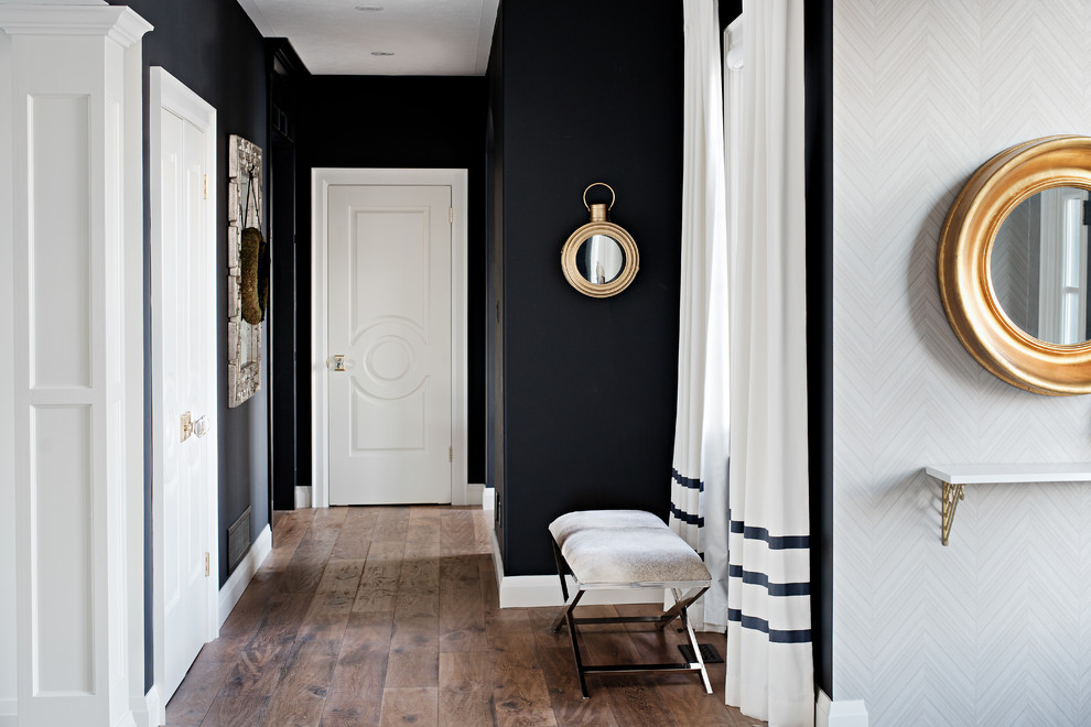Inspiration for a mid-sized transitional hallway in Toronto with black walls and medium hardwood floors.