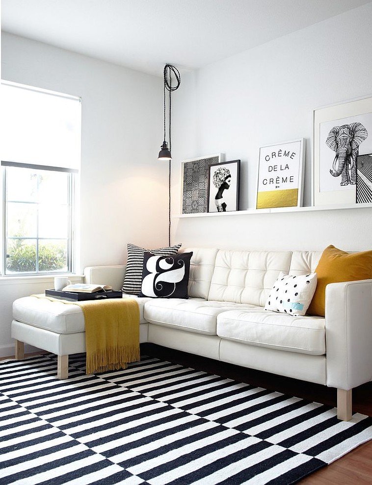 Inspiration for a contemporary living room in Orange County with white walls, medium hardwood floors and brown floor.