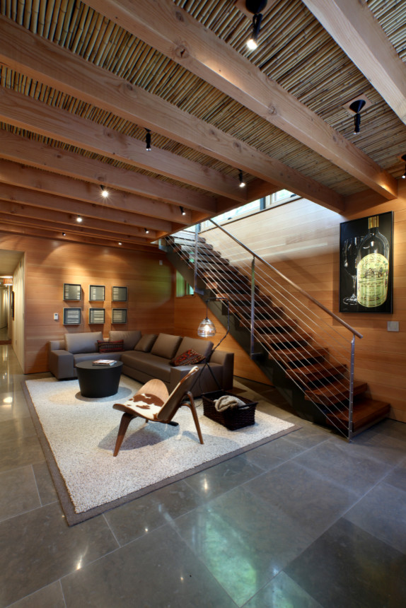 Example of a large trendy walk-out ceramic tile basement design in Grand Rapids