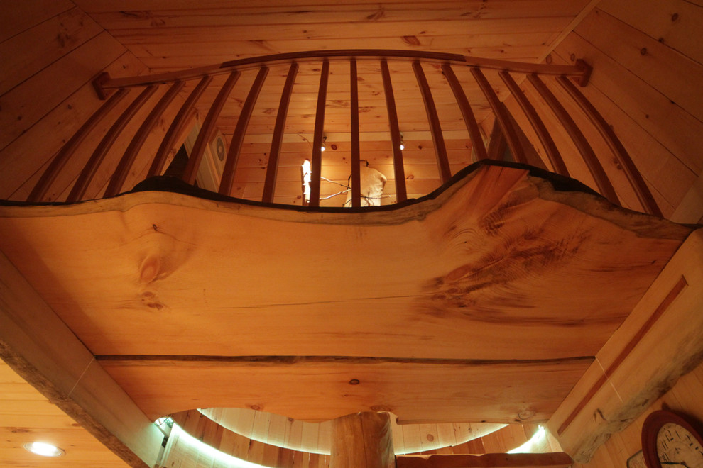 Mid-sized mountain style wooden straight open and wood railing staircase photo in Burlington