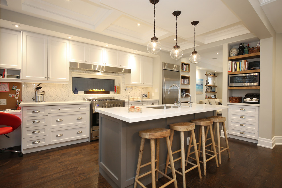 Example of a large transitional single-wall medium tone wood floor open concept kitchen design in Toronto with an island, an undermount sink, shaker cabinets, white cabinets, quartzite countertops, multicolored backsplash, stone tile backsplash and stainless steel appliances