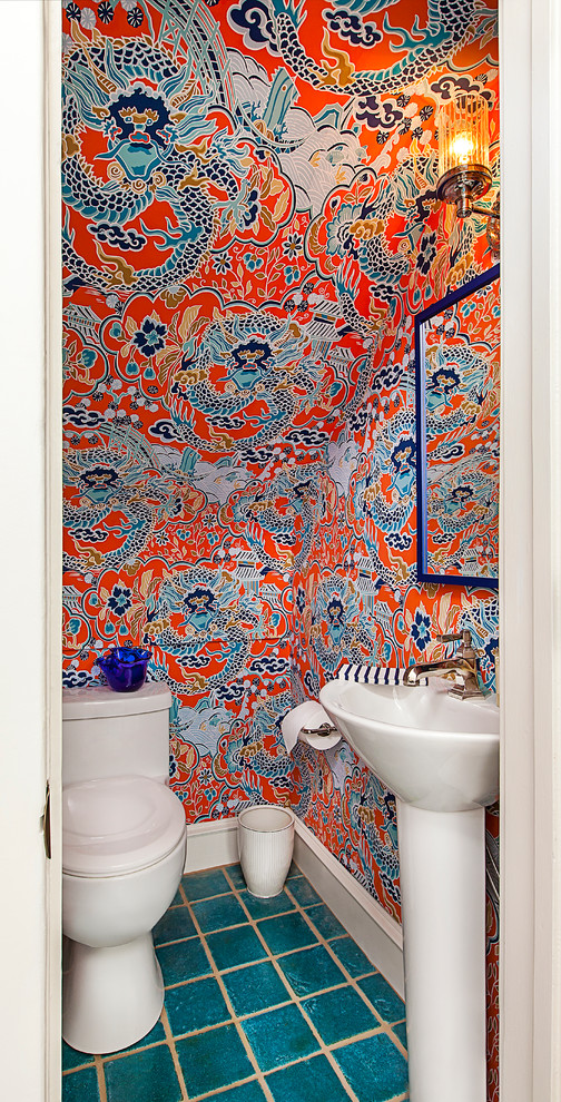 Photo of a small eclectic powder room in Detroit with blue tile, ceramic floors, a pedestal sink, red walls and blue floor.