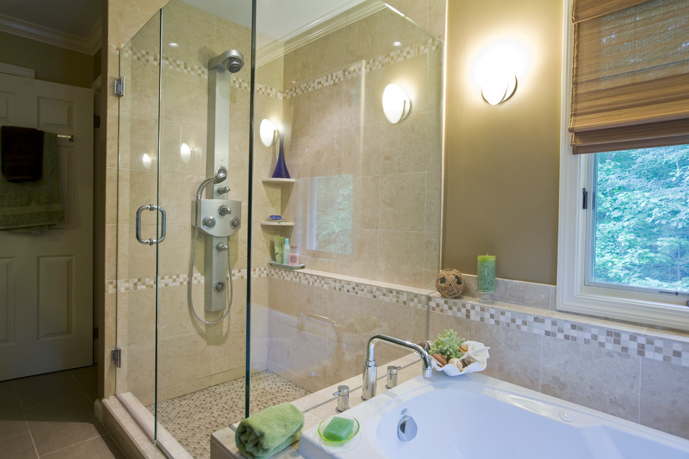 Mid-sized tropical master bathroom in Bridgeport with a vessel sink, glass-front cabinets, dark wood cabinets, glass benchtops, a drop-in tub, a shower/bathtub combo, a two-piece toilet, beige tile, porcelain tile, beige walls and porcelain floors.