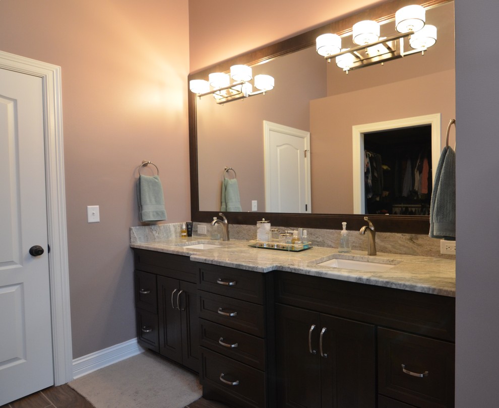 This is an example of a large transitional bathroom in Other with an undermount sink, recessed-panel cabinets, dark wood cabinets, granite benchtops, an open shower, a two-piece toilet, gray tile, porcelain tile, grey walls and porcelain floors.