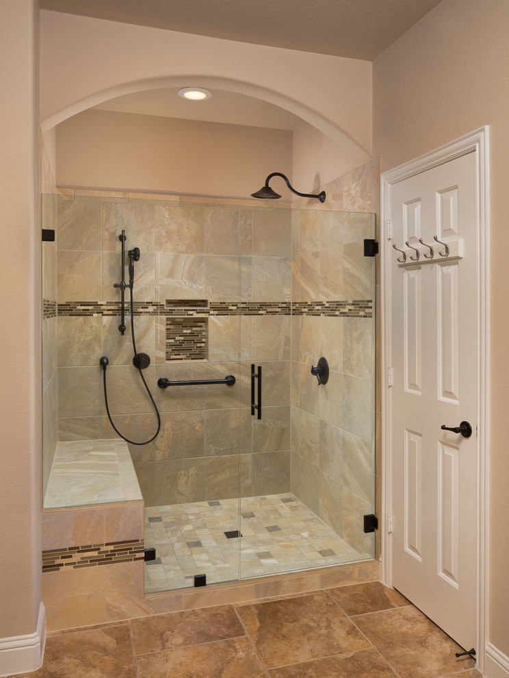 Mid-sized traditional 3/4 bathroom in Austin with an alcove shower, beige tile, brown tile, porcelain tile, beige walls, porcelain floors, brown floor and a hinged shower door.