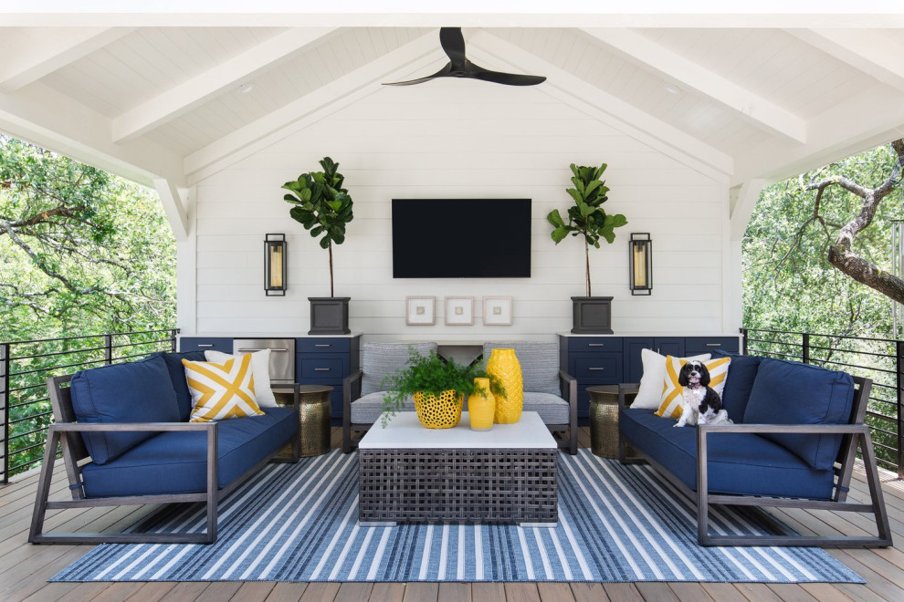 Deck - large coastal backyard metal railing deck idea in Austin with a roof extension