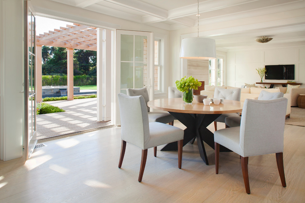 Inspiration for a mid-sized transitional open plan dining in Providence with white walls, light hardwood floors and no fireplace.