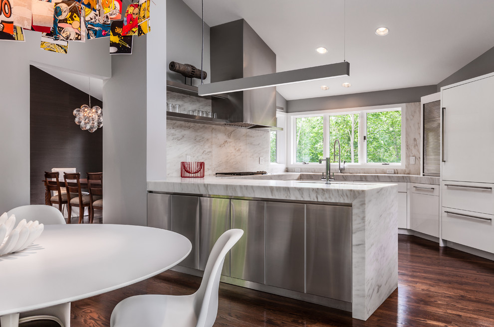 Contemporary u-shaped eat-in kitchen in Minneapolis with flat-panel cabinets, white cabinets and panelled appliances.