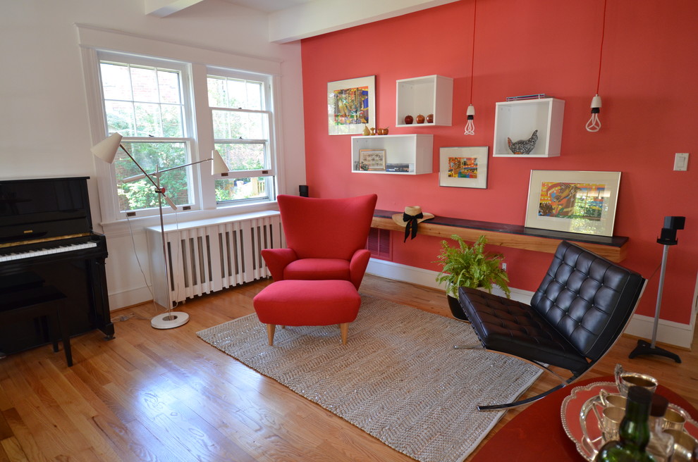 Modern living room in DC Metro with a music area and red walls.