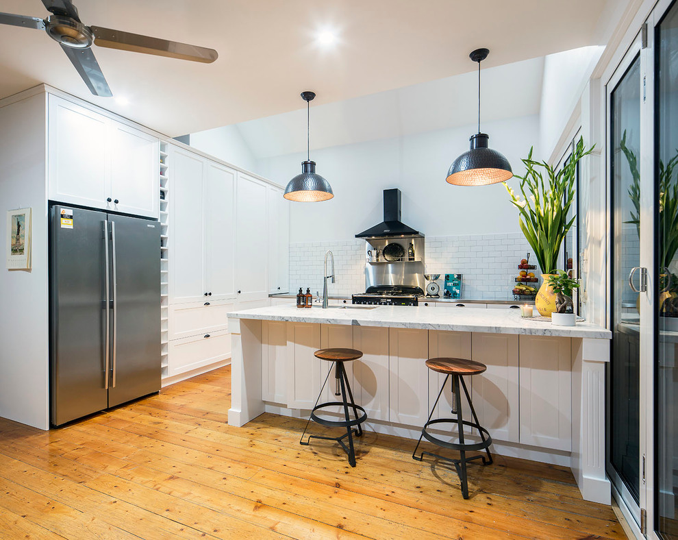 This is an example of a shabby-chic style kitchen in Melbourne.