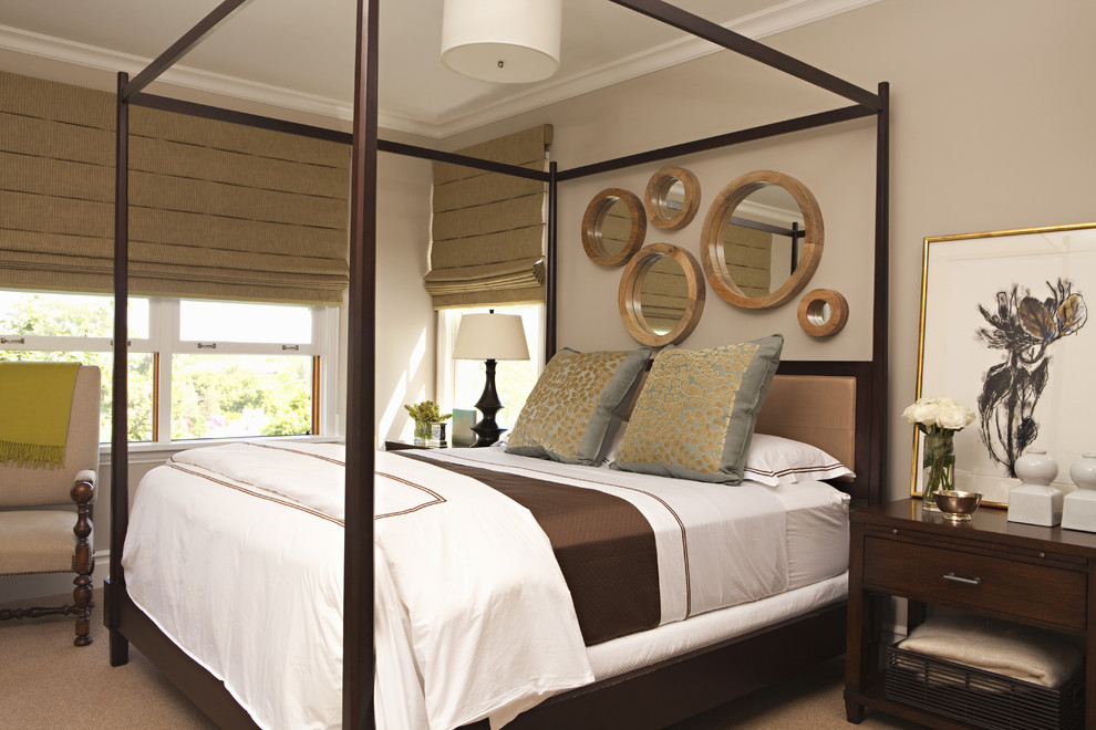 This is an example of a transitional bedroom in Los Angeles with beige walls.
