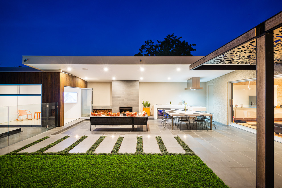 Design ideas for a contemporary patio in Melbourne with a roof extension.