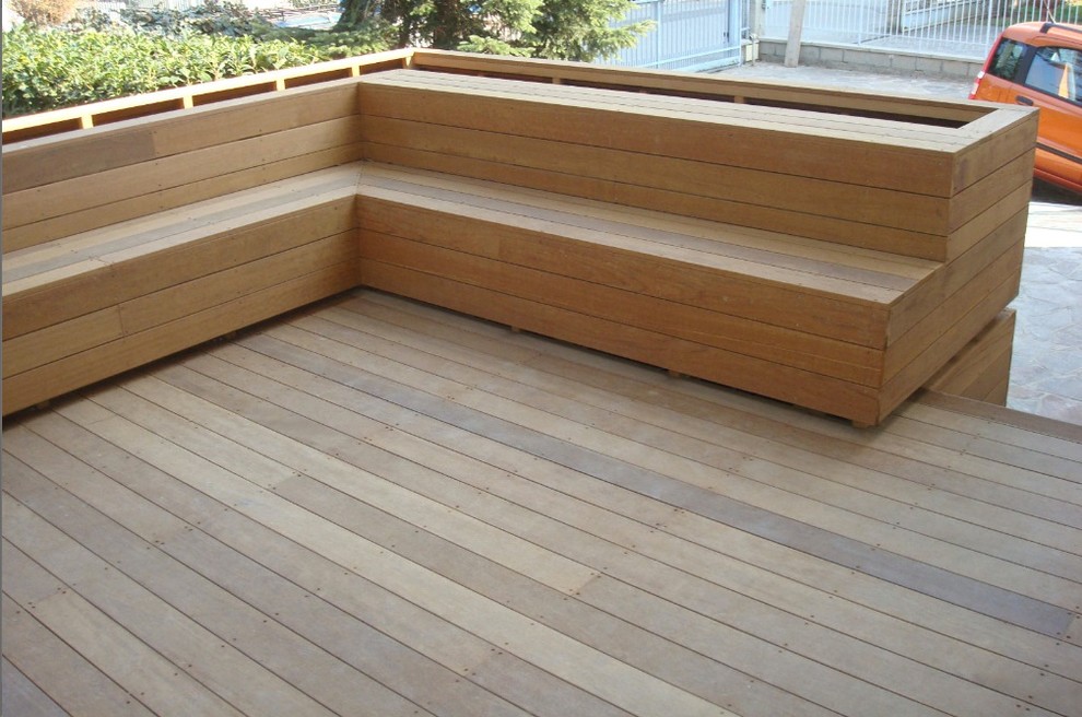 This is an example of a modern backyard deck in Miami with no cover.