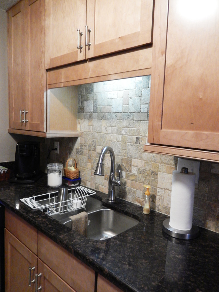 Eat-in kitchen - small transitional galley porcelain tile eat-in kitchen idea with an undermount sink, shaker cabinets, light wood cabinets, laminate countertops, multicolored backsplash, stainless steel appliances, beige walls and no island