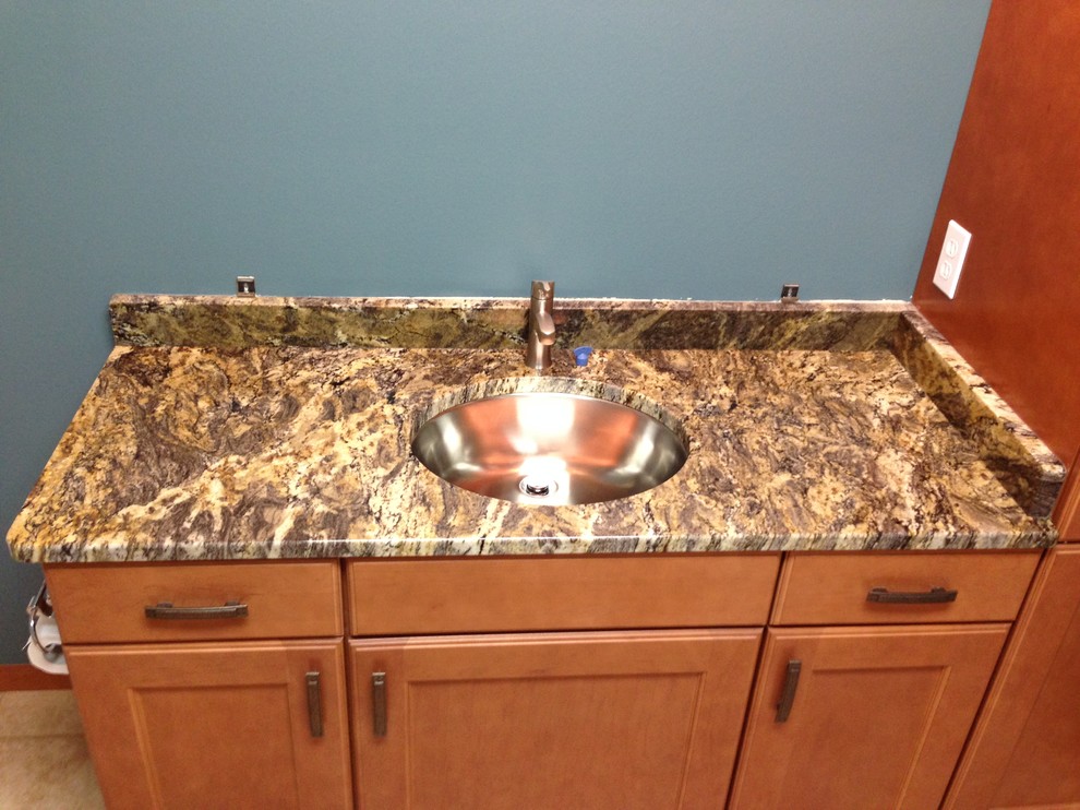 Bathroom - mid-sized eclectic bathroom idea with an undermount sink, recessed-panel cabinets, light wood cabinets and granite countertops