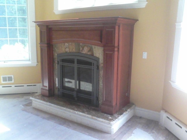 This is a Regency Bellavista direct vent gas fireplace in a Collinswood mantel cabinet.