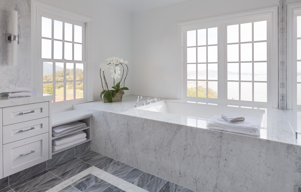 Mid-sized contemporary master bathroom in San Francisco with shaker cabinets, grey cabinets, an undermount tub, an alcove shower, a two-piece toilet, gray tile, white tile, stone slab, white walls, porcelain floors, an undermount sink and marble benchtops.