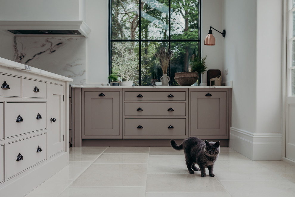 Large country u-shaped eat-in kitchen in Surrey with a drop-in sink, beaded inset cabinets, pink cabinets, marble benchtops, white splashback, marble splashback, stainless steel appliances, limestone floors, with island, beige floor, white benchtop and vaulted.