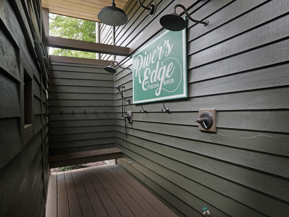 Photo of a country deck in Atlanta with an outdoor shower and a roof extension.