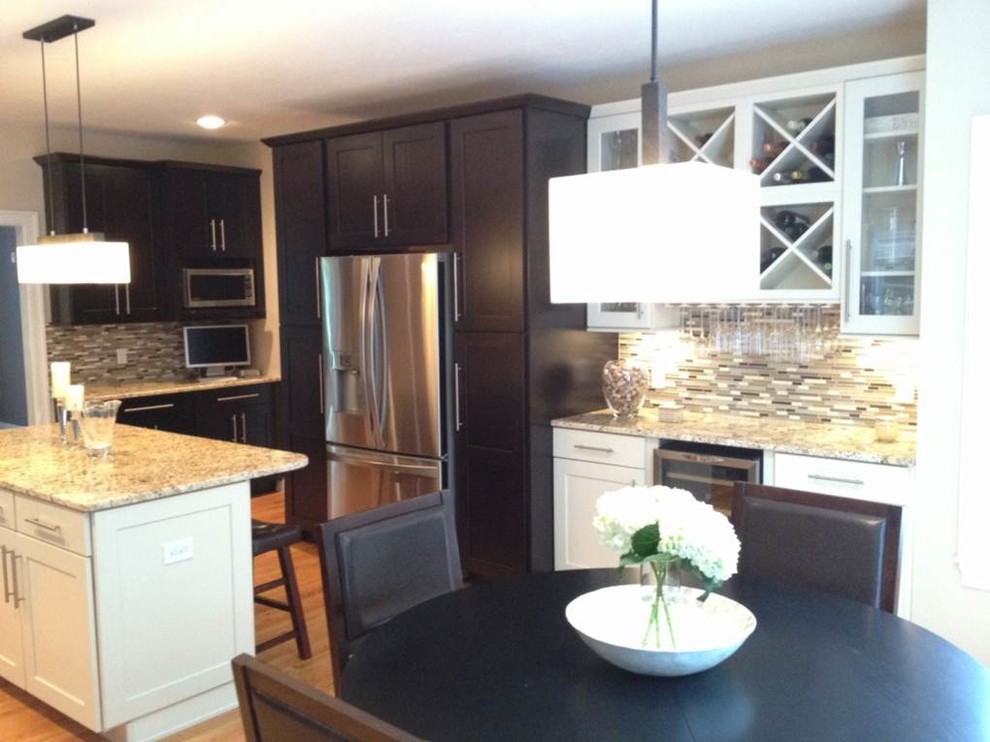 Large transitional light wood floor eat-in kitchen photo in Austin with shaker cabinets, dark wood cabinets, quartzite countertops, stainless steel appliances, beige walls and an island